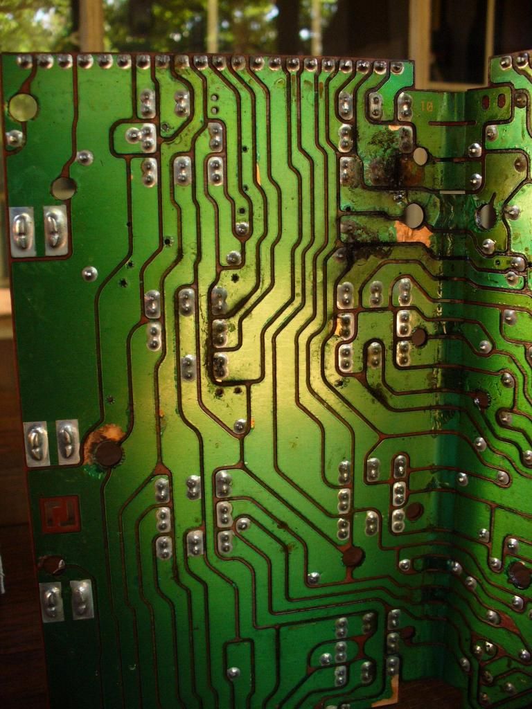 Fusebox PCB opened showing grime causing short circuits.